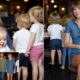 Taylor Swift Turns Babysitter at Travis Kelce’s Steakhouse Launch, Holding Baby Golden Raye and Playing with Sterling & Bronze